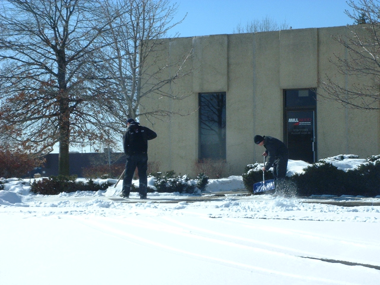 Snow Shovelers Removing Snow from Cleveland Sidewalks