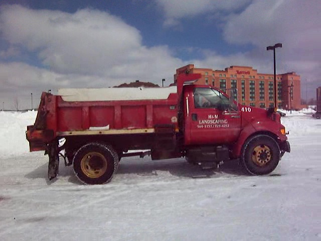 Salt Truck Spreading Salt to melt snow and ice in Cleveland Parking Lot