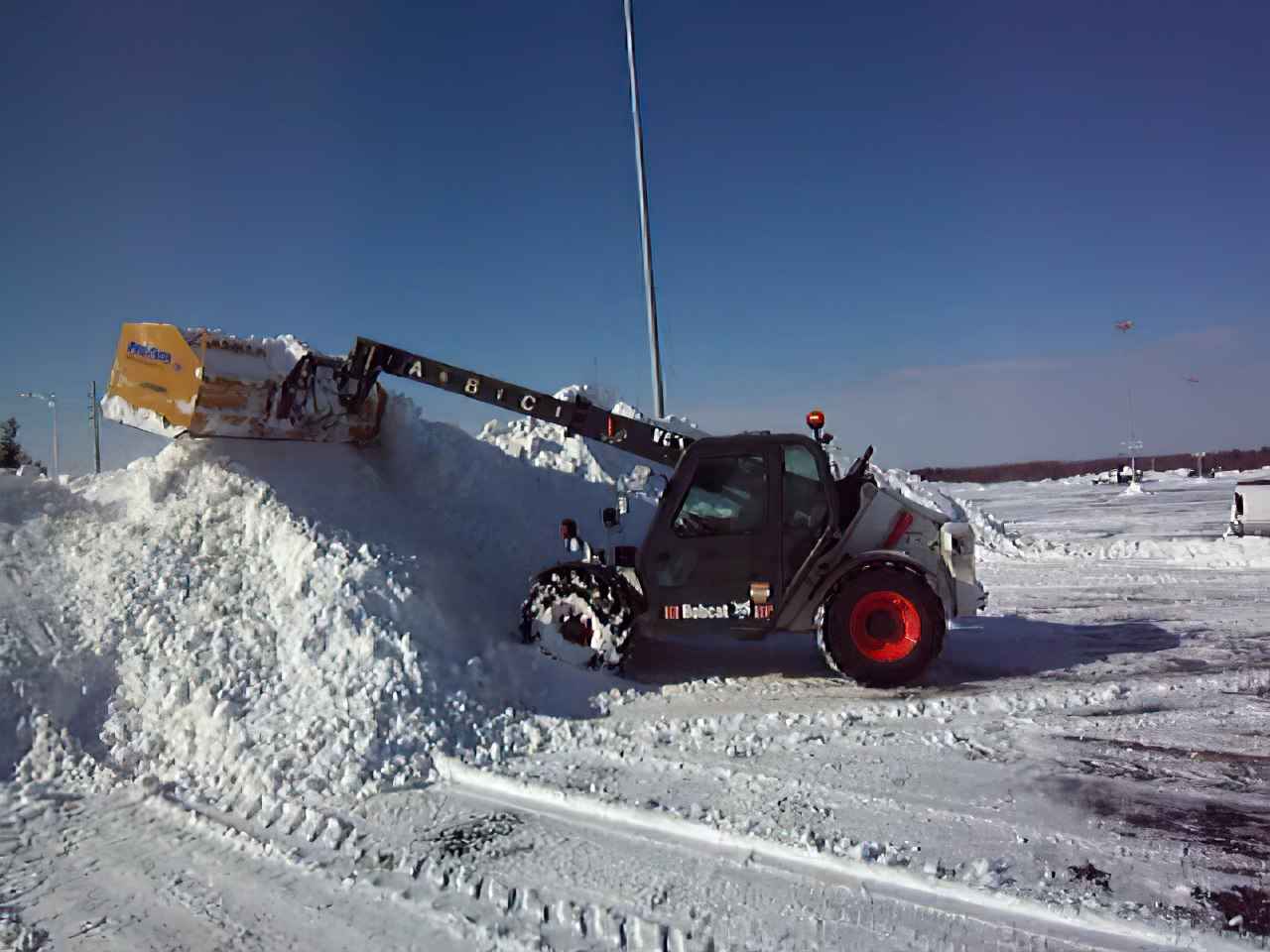 Telehandler Used by H&M Snow Pros for Snow Removal in Cleveland Parking Lot.