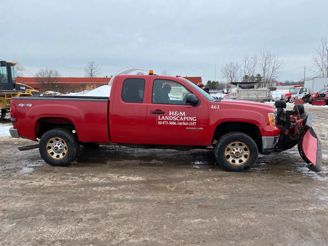 Pickup Truck with V-Plow Plowing Snow in Cleveland Parking Lot