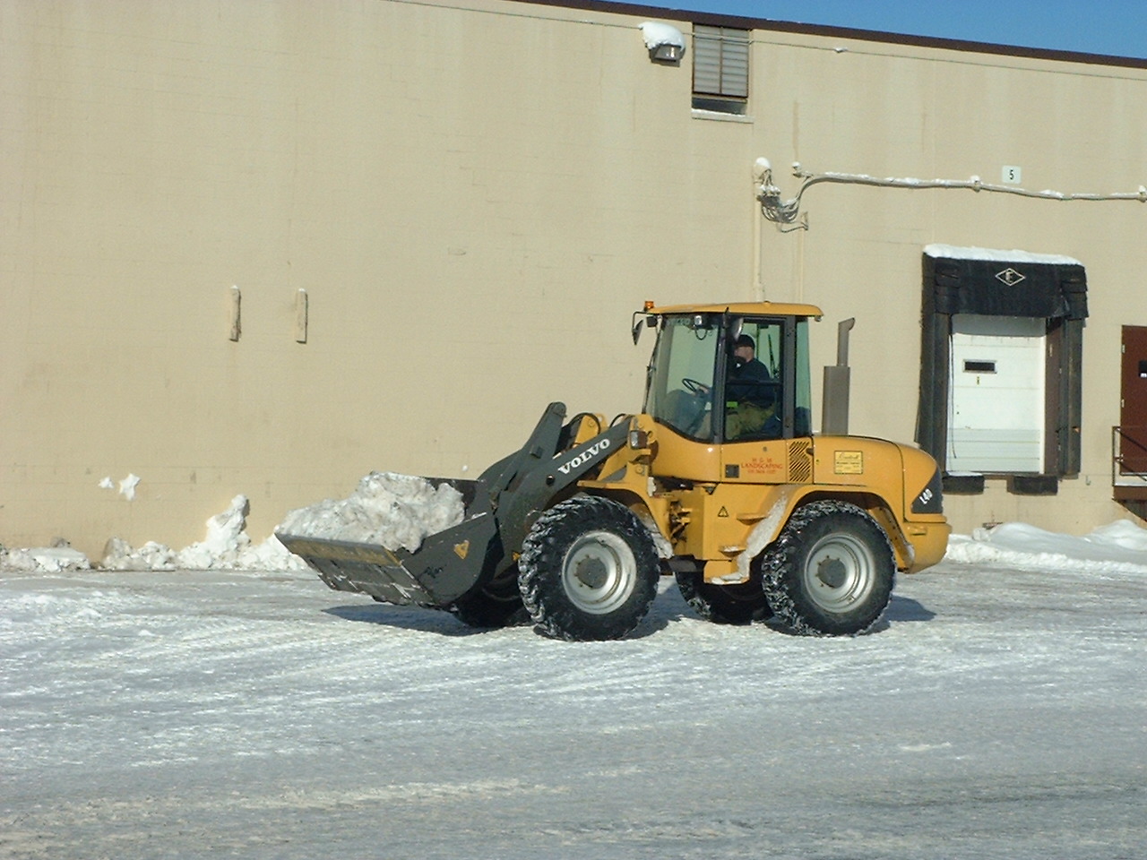 Front End Loader Used for Snow Removal in Parking Lot