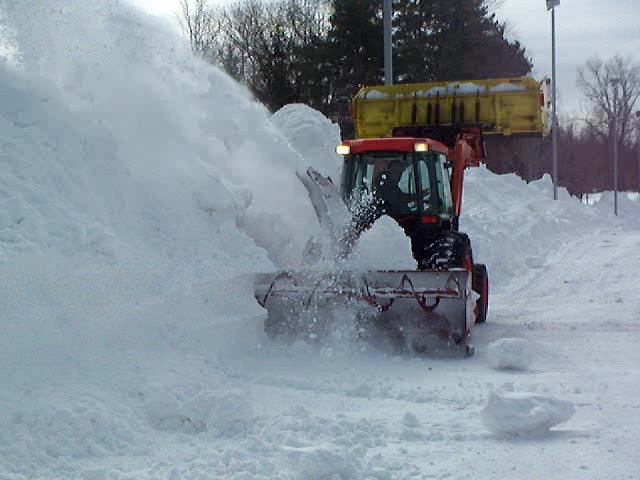 Commercial Snow Blower Removing Snow from Cleveland Parking Lot